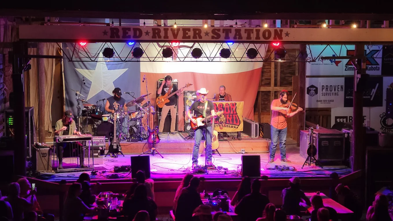 Six-piece country band with fiddle player on the Red River Station stage